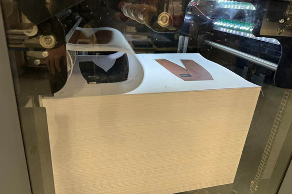 Printed sheets in a press stacker 