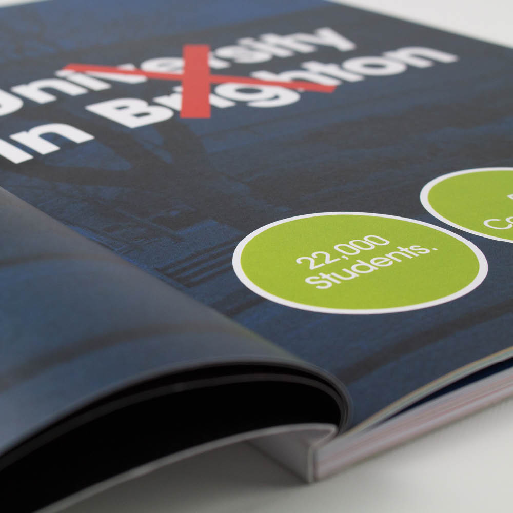 A picture showing an open perfect bound book