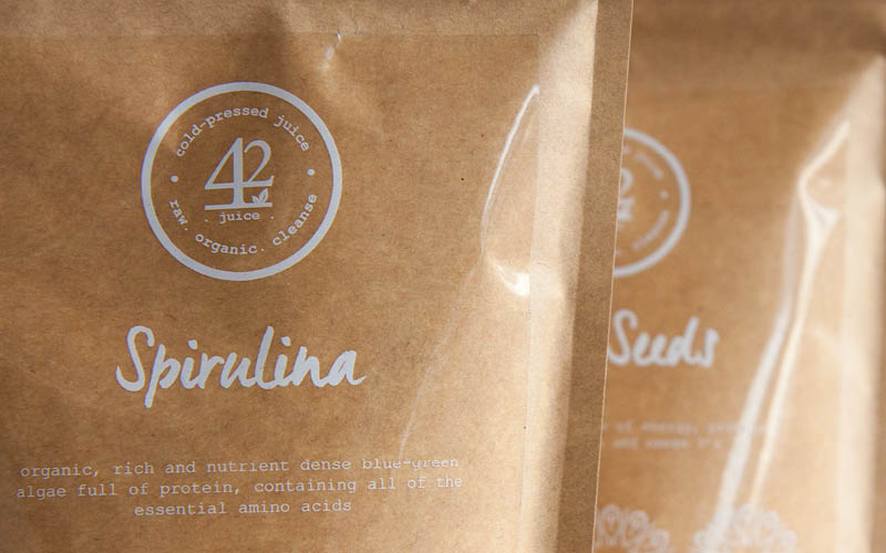 Two brown packets labeled 